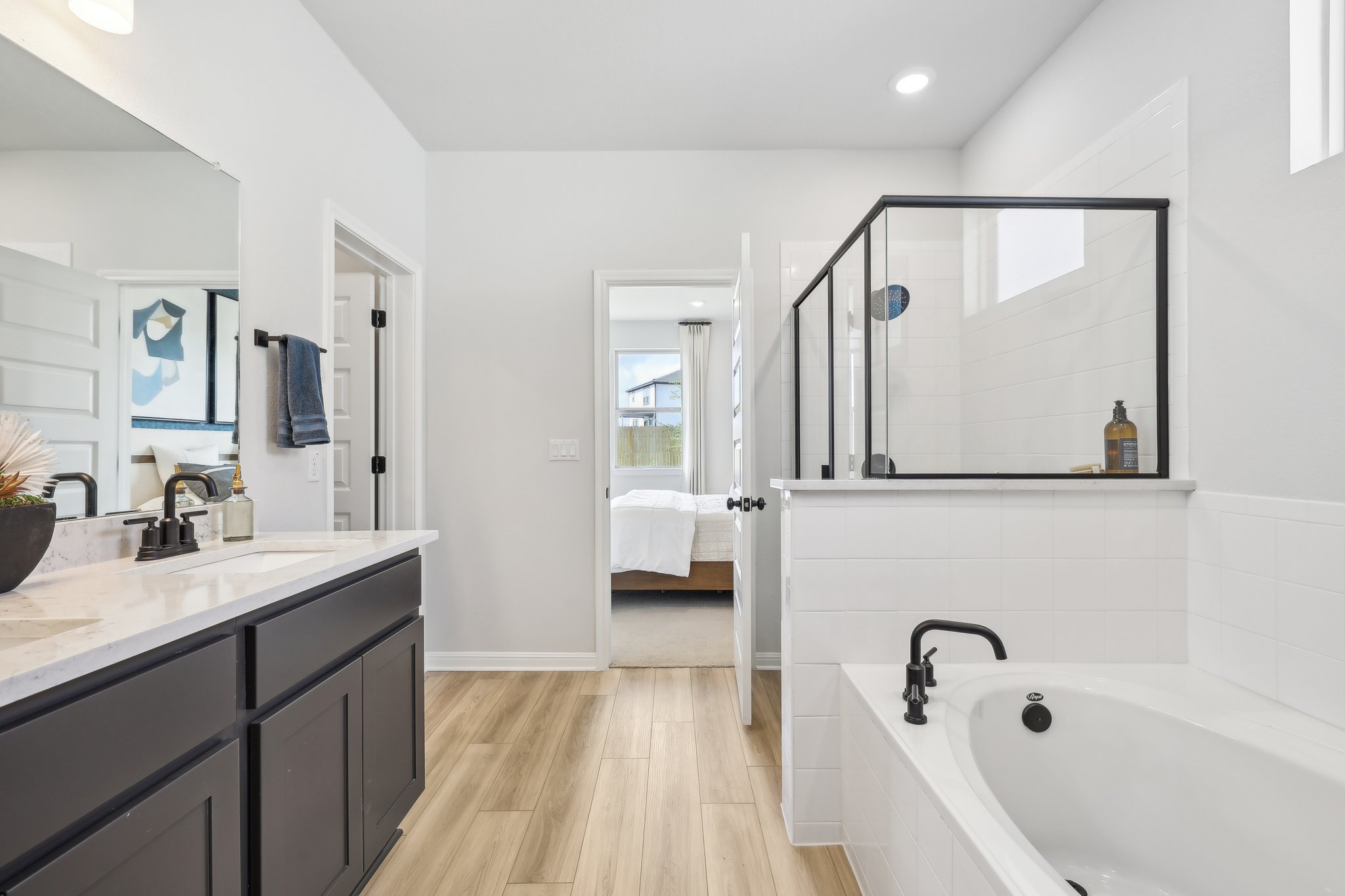A bathroom with a tub and sink.