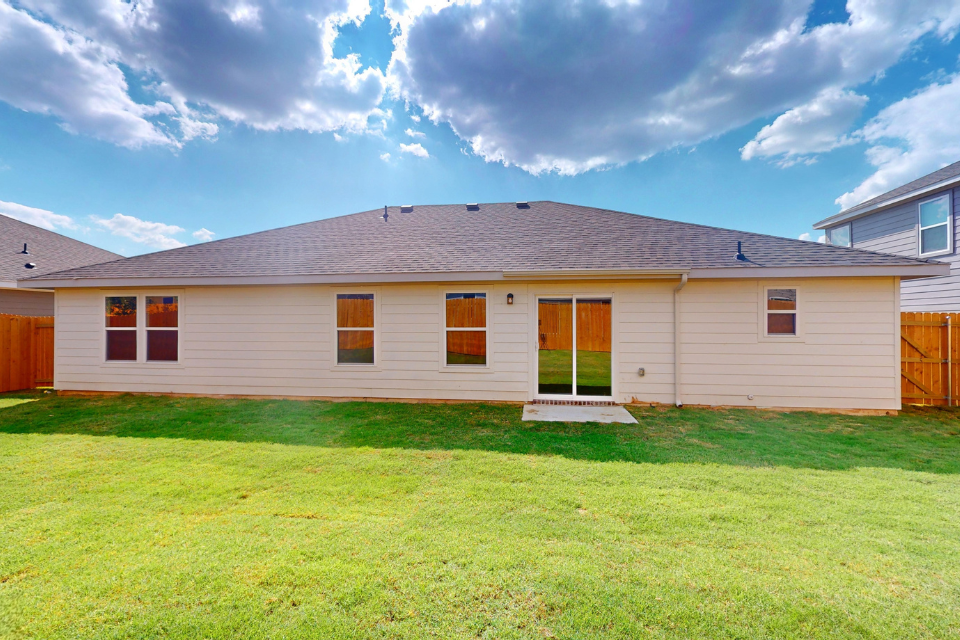 A house with a grass yard.