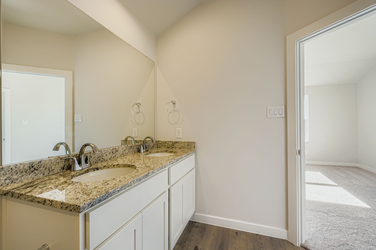 A bathroom with a marble countertop.