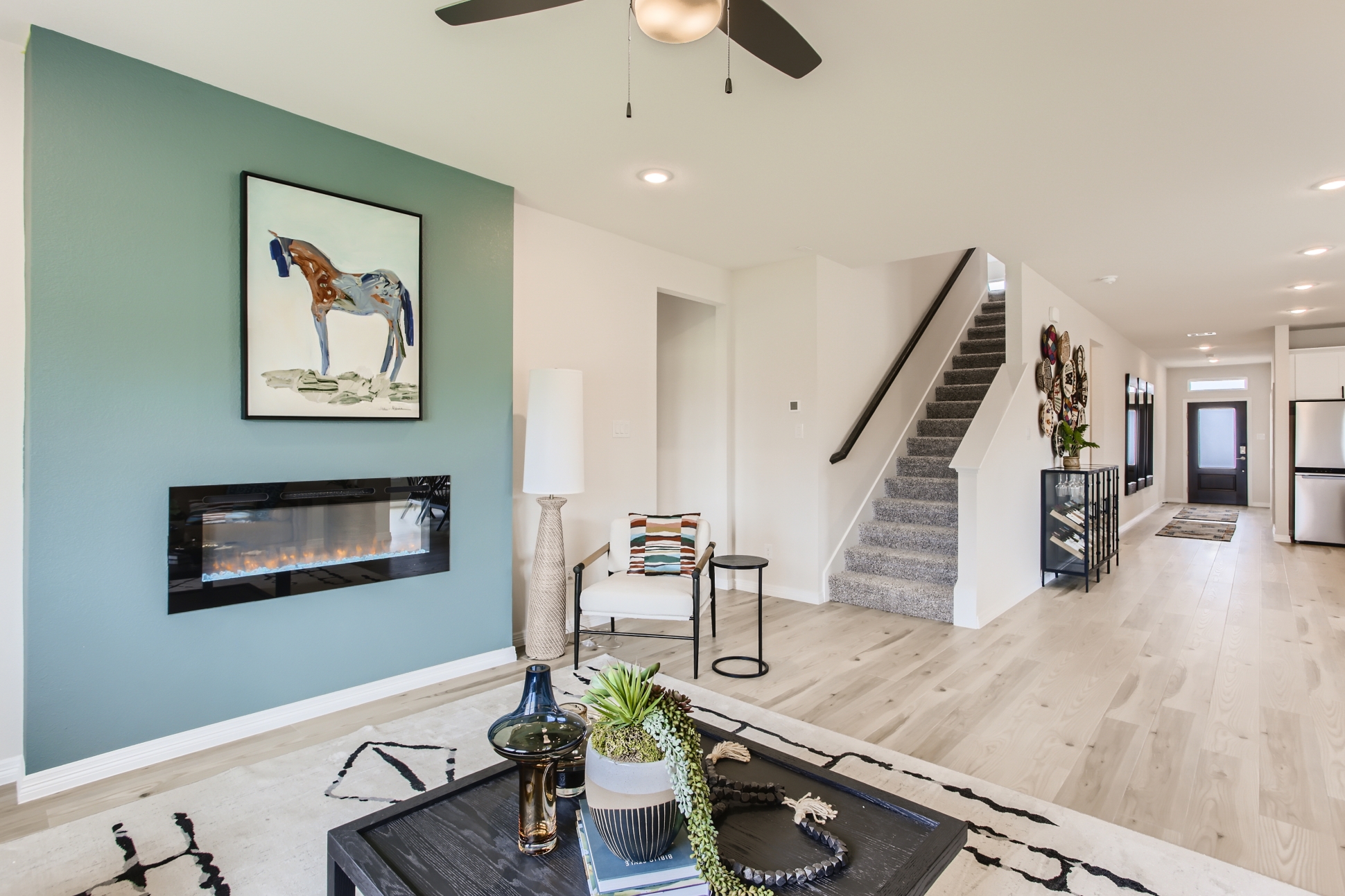 A large living room with a staircase.