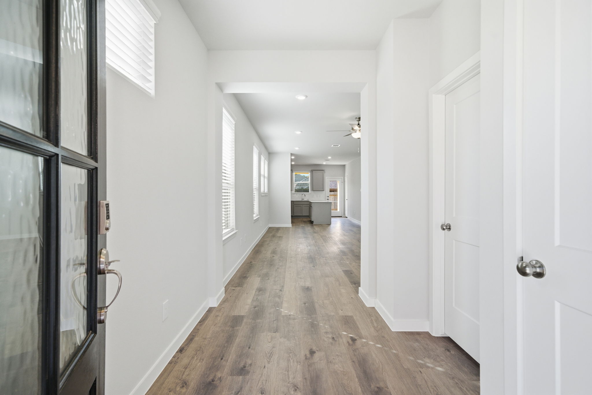 A hallway with white doors.