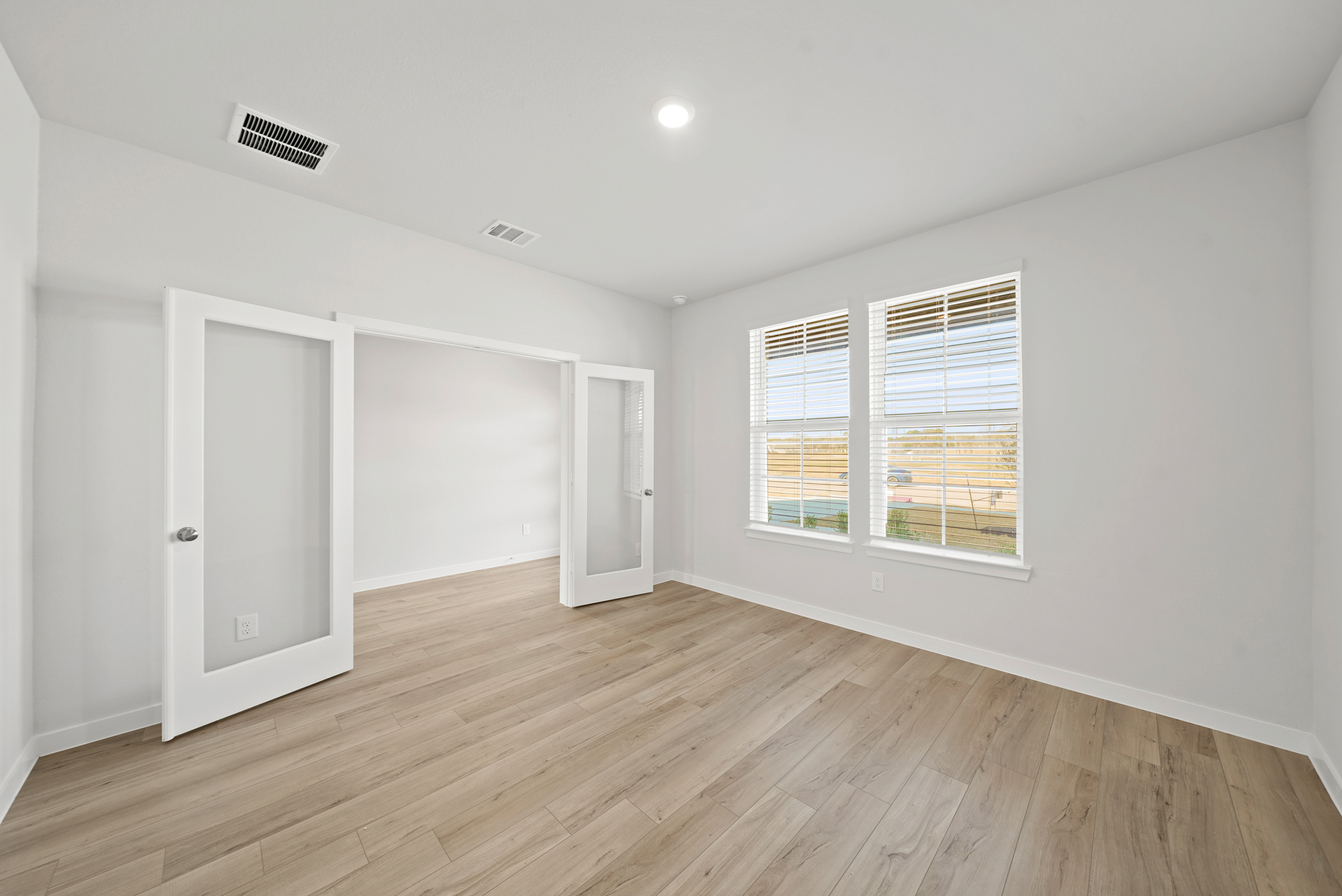 A room with a wood floor and a wood floor.