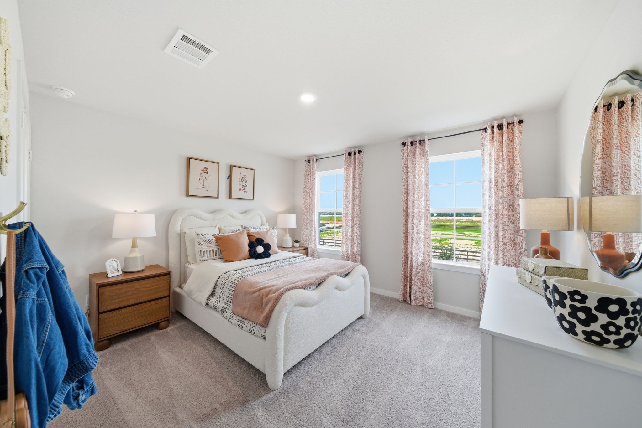 A bedroom with a large window.