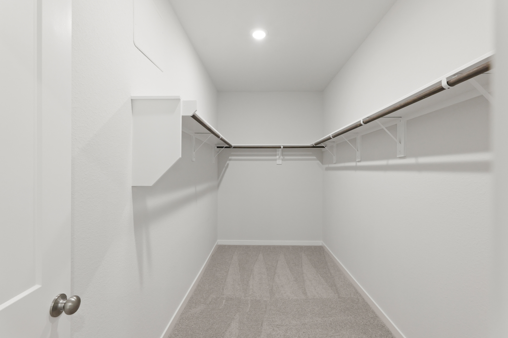 A white hallway with white walls.