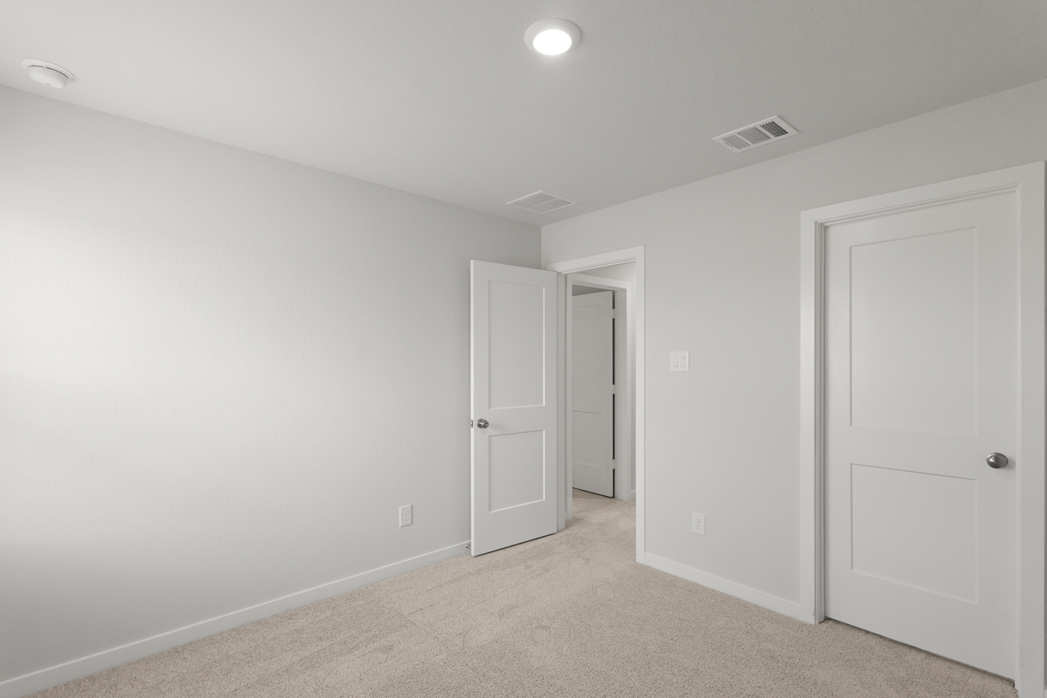 A room with white doors.