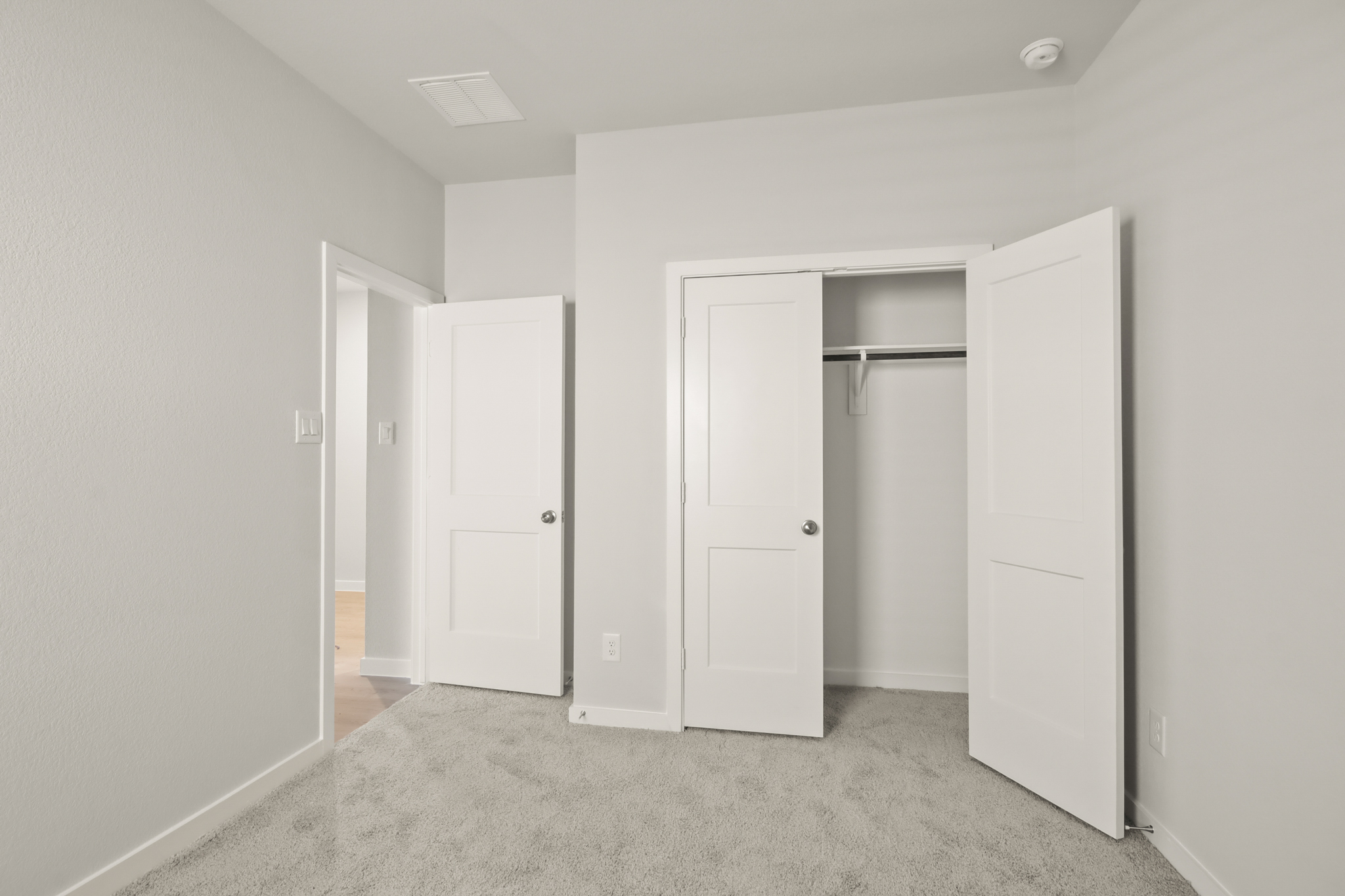 A room with white doors.