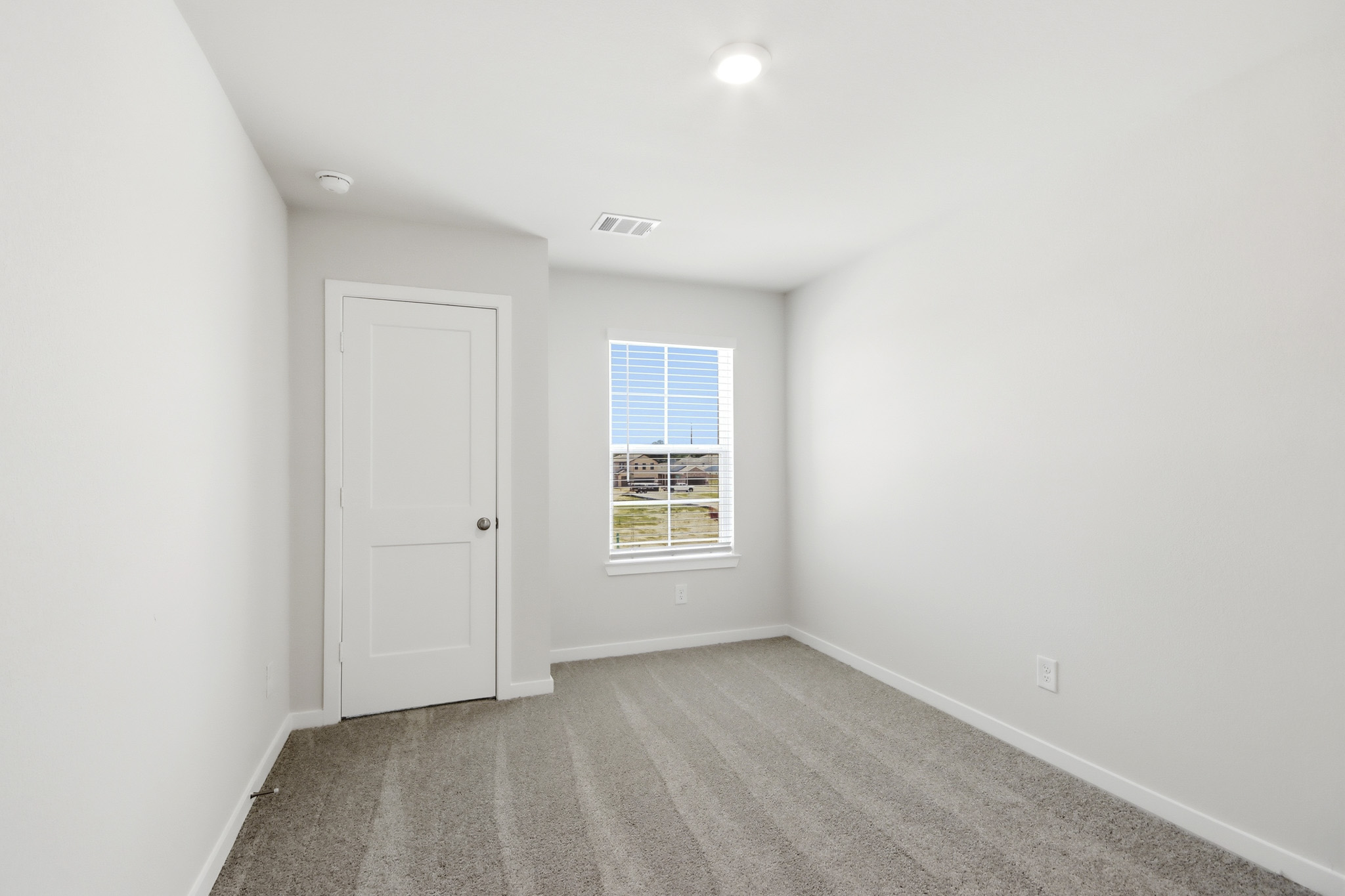 A room with a door and a window.
