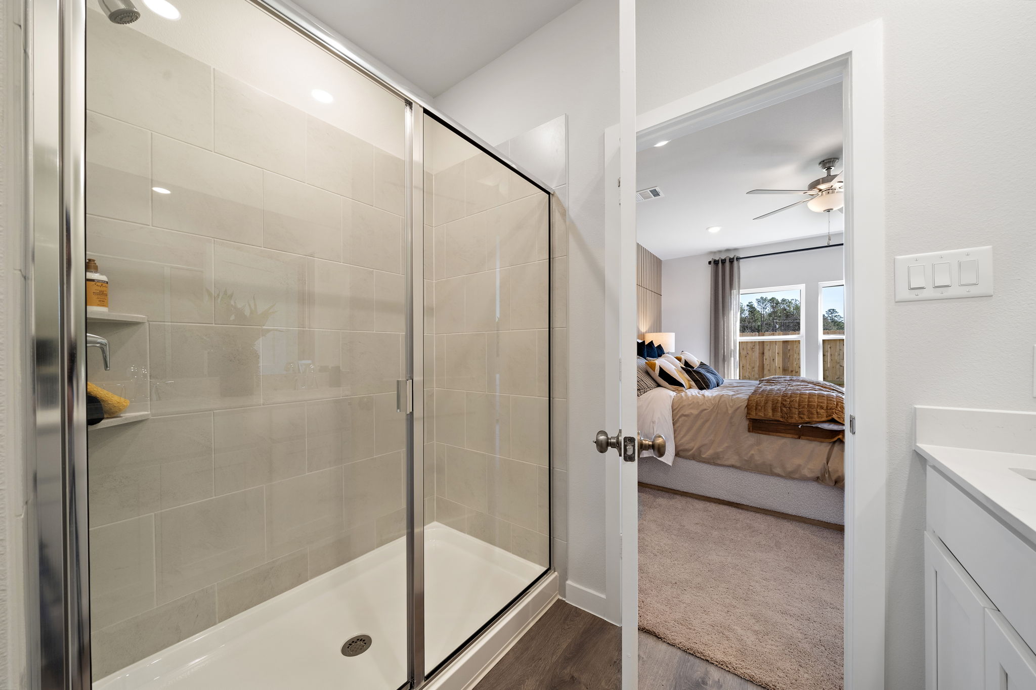 A bathroom with a glass shower.