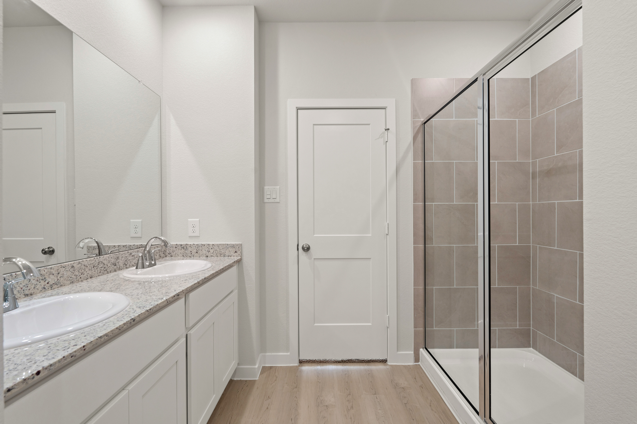 A bathroom with a glass shower.
