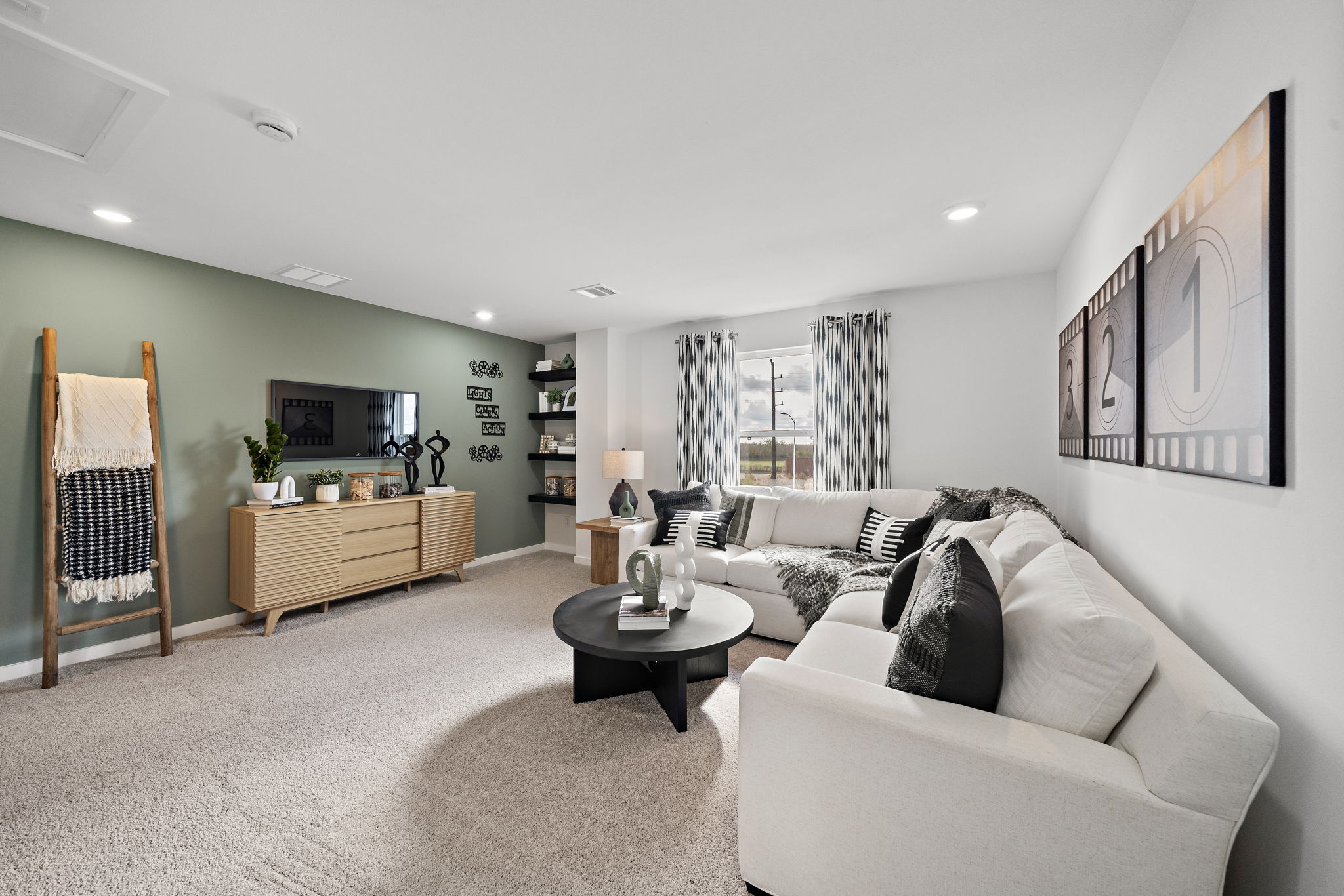 A living room with a couch and a table.