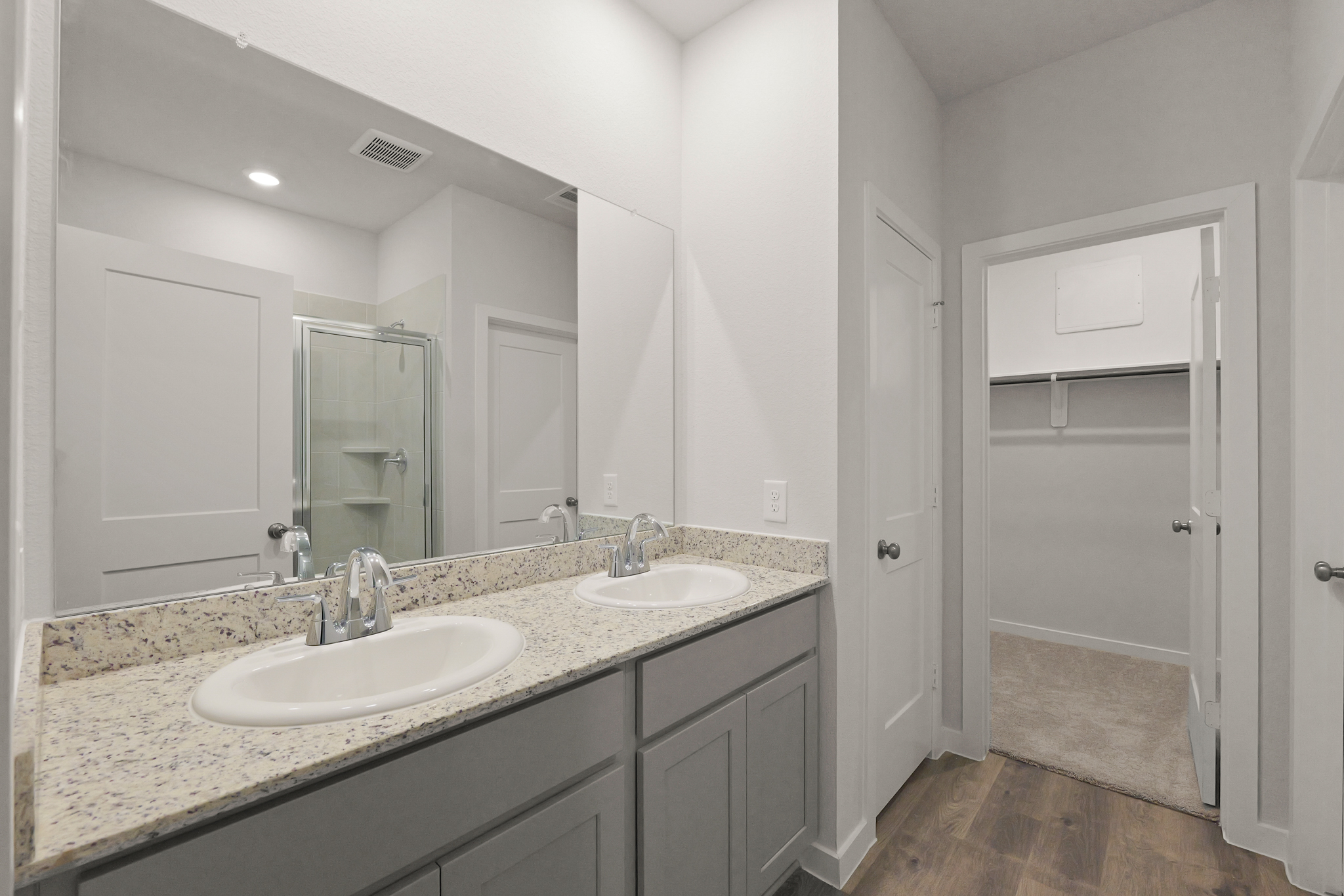 A bathroom with a marble countertop.