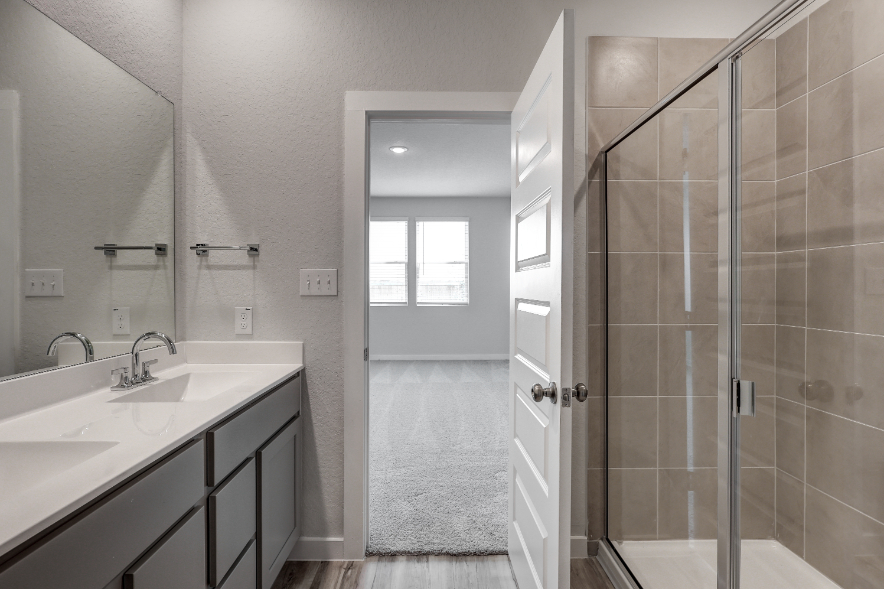 A bathroom with a glass shower.