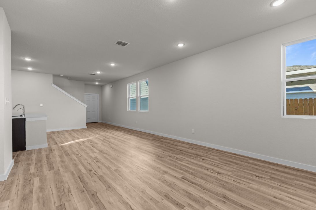 A room with a wood floor and a wood floor.