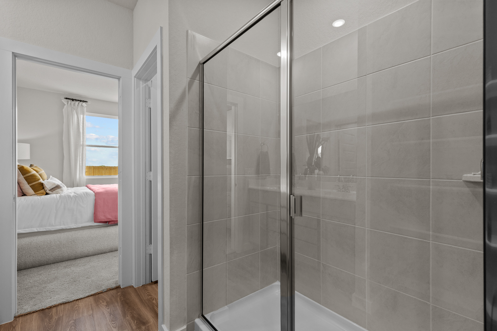 A bathroom with a glass shower.