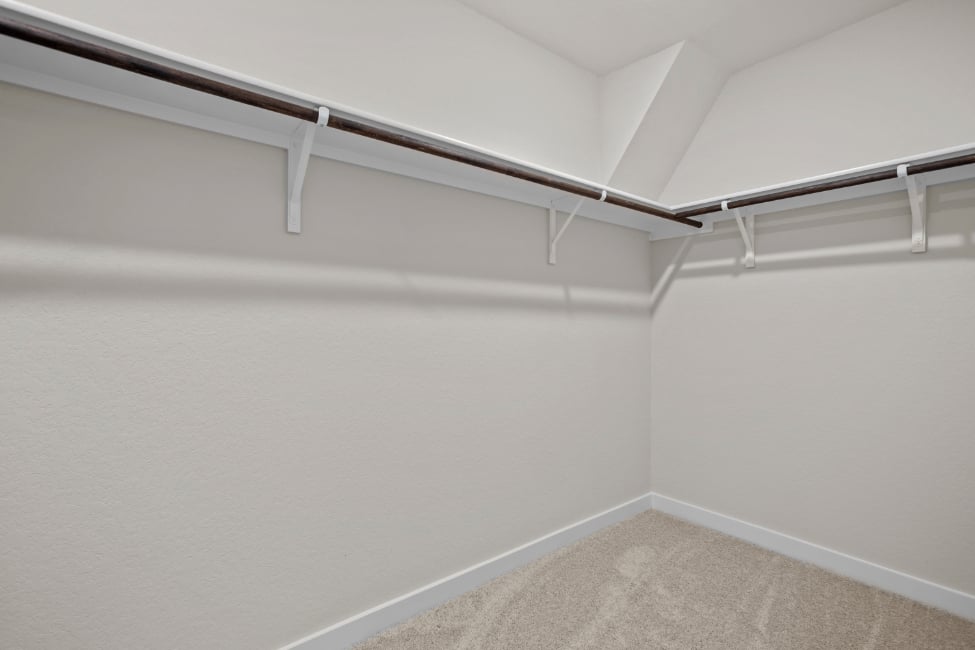 A white wall with a white railing.