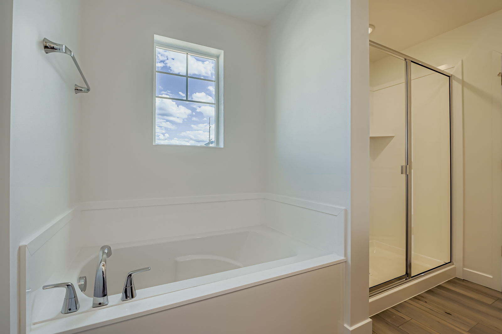 A bathroom with a tub and shower.