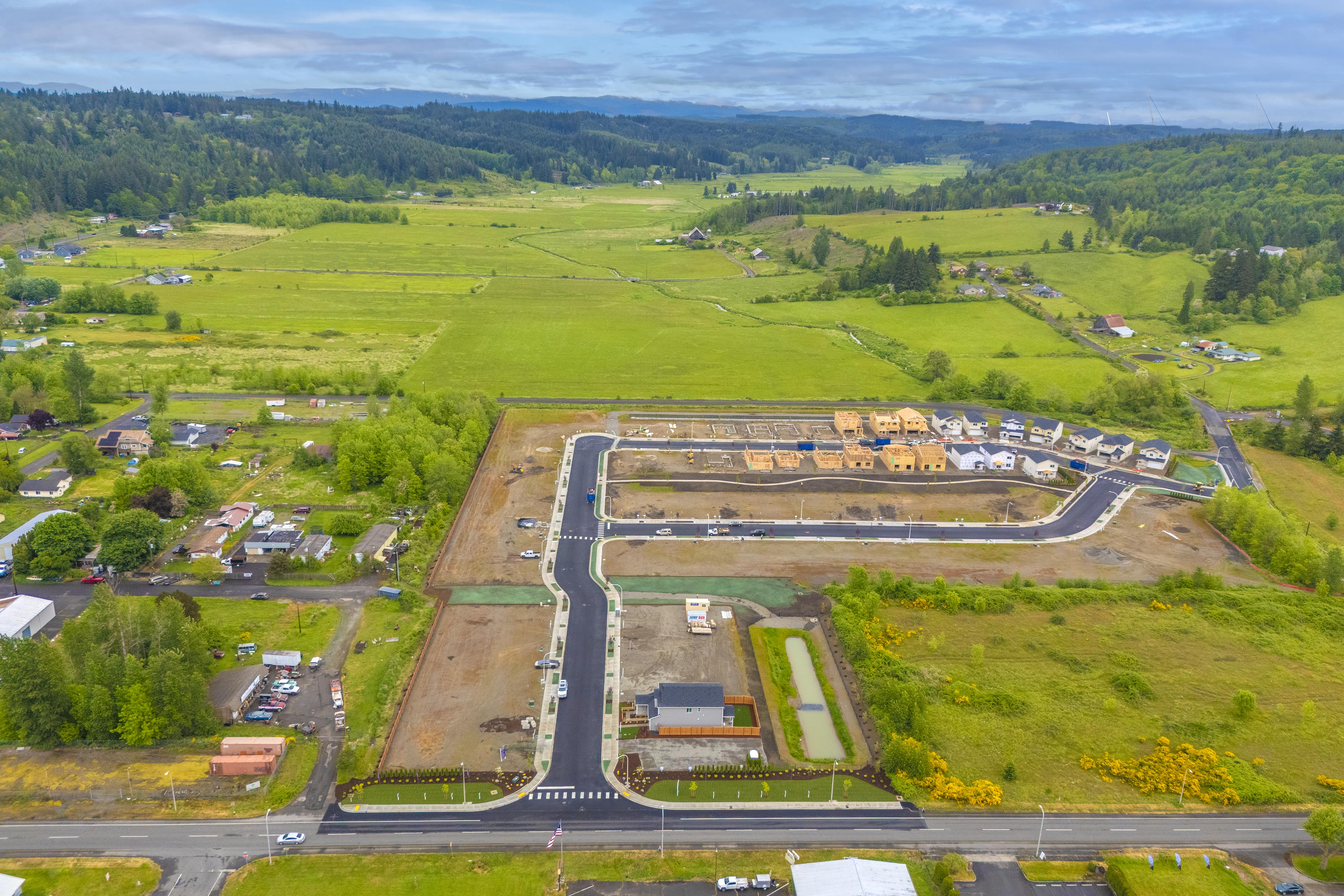 An aerial view of a road and fields.