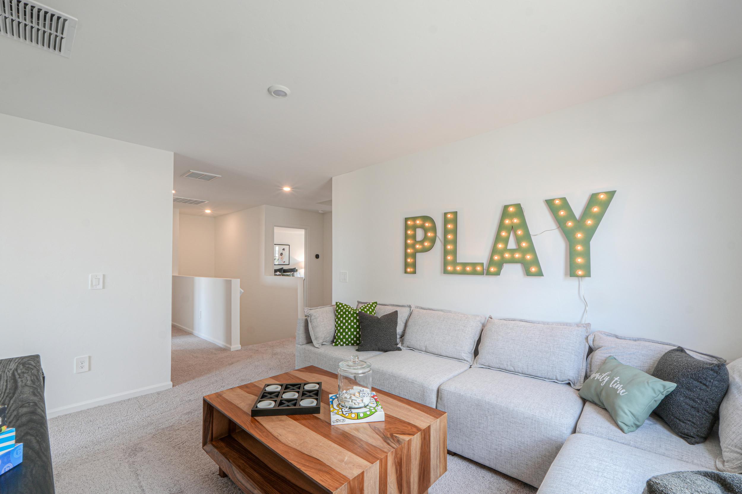 A living room with a couch and a coffee table.