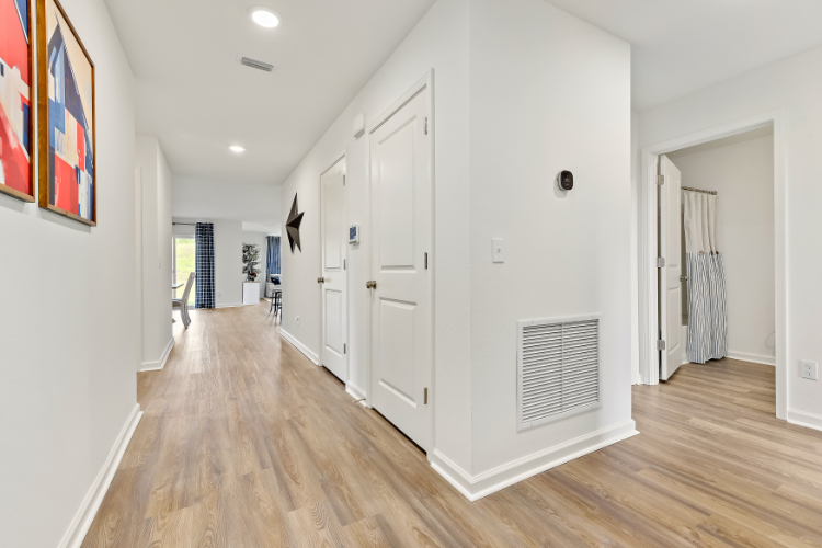 A room with white cabinets.