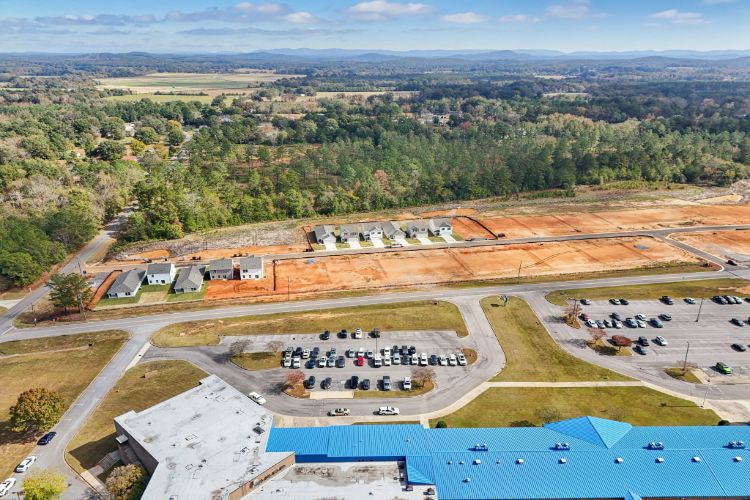 A large area with buildings and trees.
