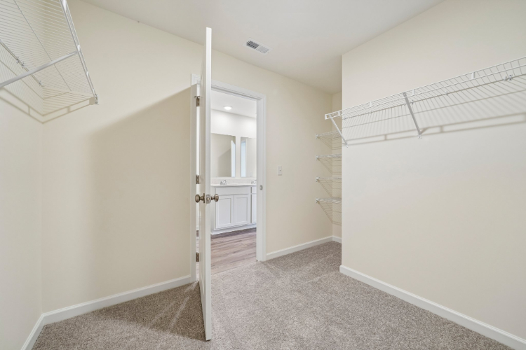 A hallway with white walls.