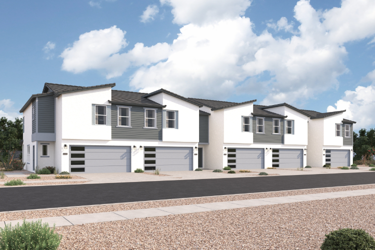 A white house with garages.