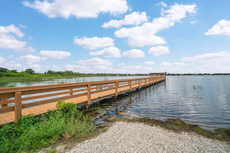 A wooden bridge over a body of water.