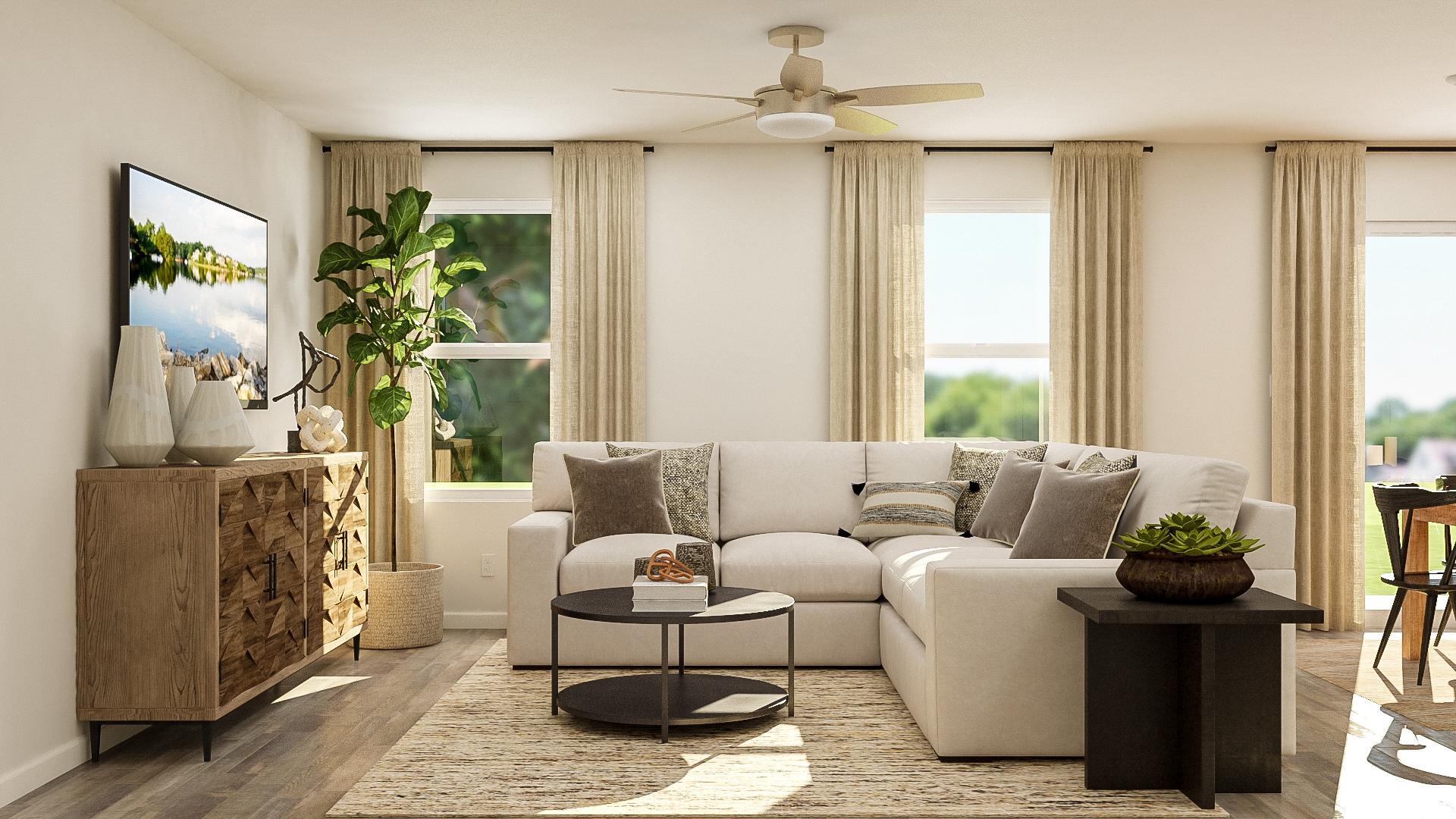 A living room with a white couch and a table.