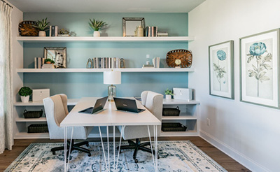 A room with a table and chairs.
